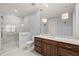 Bright bathroom featuring marble floors, vanity with drawers, and walk-in glass shower at 40 Park Meadow Ln, Youngsville, NC 27596