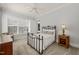 Bright bedroom with neutral walls and carpet features a metal bedframe at 40 Park Meadow Ln, Youngsville, NC 27596