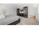 Large bedroom with tray ceilings, media center, and bright windows at 40 Park Meadow Ln, Youngsville, NC 27596