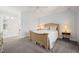 Inviting bedroom showcases neutral walls, carpet flooring, a ceiling fan, and ample natural light at 40 Park Meadow Ln, Youngsville, NC 27596