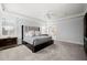 Open bedroom showing ensuite bathroom, tray ceilings, and plantation shutters at 40 Park Meadow Ln, Youngsville, NC 27596