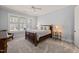 Cozy bedroom with natural light and neutral décor at 40 Park Meadow Ln, Youngsville, NC 27596