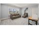 Cozy bonus room with leather sofa, armchair and window with a view at 40 Park Meadow Ln, Youngsville, NC 27596
