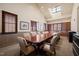 A bright conference room boasts a skylight, large table with seating, and wood shelving at 40 Park Meadow Ln, Youngsville, NC 27596