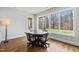 Bright dining area features a table with chairs and a large window that shows a view of the backyard at 40 Park Meadow Ln, Youngsville, NC 27596
