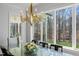 Dining room with views of mature trees, hardwood floors, and chandelier at 40 Park Meadow Ln, Youngsville, NC 27596