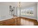 Bright dining room with hardwood floors, large windows and decorative gold chandelier at 40 Park Meadow Ln, Youngsville, NC 27596