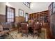 Dining room featuring a round table, wood floors, built-in shelves, and decorative accents at 40 Park Meadow Ln, Youngsville, NC 27596