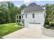 Exterior of home highlighting the attached two car garage and verdant lawn with manicured landscaping at 40 Park Meadow Ln, Youngsville, NC 27596