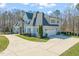 Beautiful two-story home features stone accents, a three-car garage, and a spacious driveway at 40 Park Meadow Ln, Youngsville, NC 27596