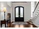 The foyer welcomes guests with hardwood floors, beautiful front doors, and classic trim at 40 Park Meadow Ln, Youngsville, NC 27596