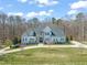 Traditional style home with stone accents, blue shutters, manicured lawn, and inviting curb appeal at 40 Park Meadow Ln, Youngsville, NC 27596