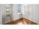 Hallway features hardwood floors, neutral walls, and views into the bathroom and another room at 40 Park Meadow Ln, Youngsville, NC 27596