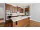 Spacious kitchen island with marble countertop, stainless steel appliances, and custom wood cabinets at 40 Park Meadow Ln, Youngsville, NC 27596