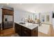Gourmet kitchen island boasts stainless steel appliances, marble countertops, and dark wood cabinets at 40 Park Meadow Ln, Youngsville, NC 27596
