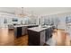 Open-concept kitchen featuring dual islands, modern appliances, and hardwood floors at 40 Park Meadow Ln, Youngsville, NC 27596