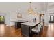 Expansive kitchen with dual islands, designer lighting, and breakfast bar seating at 40 Park Meadow Ln, Youngsville, NC 27596