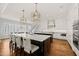 Spacious kitchen featuring dual islands, pendant lighting, and breakfast bar seating at 40 Park Meadow Ln, Youngsville, NC 27596