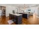 Spacious kitchen features double islands, hardwood floors, and modern stainless appliances at 40 Park Meadow Ln, Youngsville, NC 27596