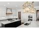 Modern kitchen features white cabinets, stone countertops, stainless appliances and large center islands at 40 Park Meadow Ln, Youngsville, NC 27596