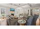 A spacious living room with high ceilings, coffered ceiling, fireplace, and views of nature at 40 Park Meadow Ln, Youngsville, NC 27596