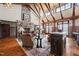 Inviting living room with high ceilings, wooden beams, and a stone fireplace at 40 Park Meadow Ln, Youngsville, NC 27596