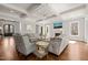Bright living room boasts coffered ceilings, fireplace, hardwood floors, and neutral-toned furnishings at 40 Park Meadow Ln, Youngsville, NC 27596