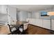 Open concept living area featuring a gaming table and chairs, and an inviting couch at 40 Park Meadow Ln, Youngsville, NC 27596