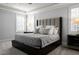 Comfortable main bedroom featuring a stylish bed, soft carpet, and plenty of light at 40 Park Meadow Ln, Youngsville, NC 27596