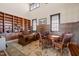 Spacious office featuring wooden bookshelves, a large desk, and a seating area with stylish rug at 40 Park Meadow Ln, Youngsville, NC 27596