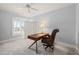 Home office with desk, leather chair, crown molding, and plenty of natural light at 40 Park Meadow Ln, Youngsville, NC 27596