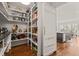 Walk-in pantry offers plentiful storage with wooden floors and conveniently located near kitchen island at 40 Park Meadow Ln, Youngsville, NC 27596