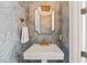 Stylish powder room with unique blue wallpaper and gold accents at 40 Park Meadow Ln, Youngsville, NC 27596