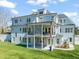 Rear exterior of home featuring porch, balcony and manicured lawn at 40 Park Meadow Ln, Youngsville, NC 27596