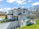 Exterior of home featuring a covered porch, balcony and a spacious yard at 40 Park Meadow Ln, Youngsville, NC 27596