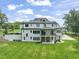 Gorgeous home boasts a spacious backyard, multi-level balconies, and manicured landscaping at 40 Park Meadow Ln, Youngsville, NC 27596