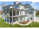 Rear exterior view of a two-story home featuring balcony and porch at 40 Park Meadow Ln, Youngsville, NC 27596