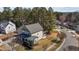 Aerial view of a two-story home featuring a spacious yard, covered porches, and mature trees at 400 Oxford Park Blvd, Oxford, NC 27565