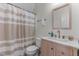 Neat bathroom featuring a modern vanity with neutral counter-tops and a shower with a stylish curtain at 400 Oxford Park Blvd, Oxford, NC 27565