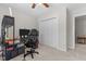 This is a carpeted bedroom with a built-in desk area and a modern black computer chair at 400 Oxford Park Blvd, Oxford, NC 27565