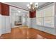 Charming dining room adjacent to bedroom with hardwood floors and stylish chandelier at 400 Oxford Park Blvd, Oxford, NC 27565