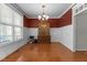 Elegant dining room with hardwood floors, a chandelier, and paneled walls, perfect for entertaining at 400 Oxford Park Blvd, Oxford, NC 27565