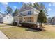 Charming two-story home with a welcoming front porch, beautiful landscaping, and a well-maintained lawn at 400 Oxford Park Blvd, Oxford, NC 27565