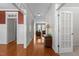 Inviting hallway with gleaming hardwood floors and decorative trim, leading to the living area at 400 Oxford Park Blvd, Oxford, NC 27565