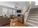 Inviting living room with hardwood floors, a cozy fireplace, and comfortable seating arrangement at 400 Oxford Park Blvd, Oxford, NC 27565