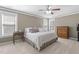 Comfortable main bedroom with neutral walls, white comforter, and soft carpet, creating a relaxing retreat at 400 Oxford Park Blvd, Oxford, NC 27565