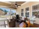 Relaxing patio with comfortable wicker seating, a ceiling fan, and neighborhood views at 400 Oxford Park Blvd, Oxford, NC 27565