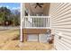 Image shows a gas pipe connection on the side of a porch with white lattice design at 400 Oxford Park Blvd, Oxford, NC 27565