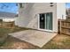 Backyard patio with sliding glass door, green grass, and fence at 406 Homestead Park Dr. Dr, Apex, NC 27502