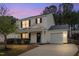 Charming two-story home with white siding, black shutters, and attached garage at 406 Homestead Park Dr. Dr, Apex, NC 27502